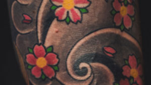 colorful tatt on arm - red color tattoo