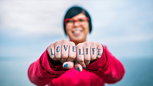red-jacket-woman-with-finger-tattoo